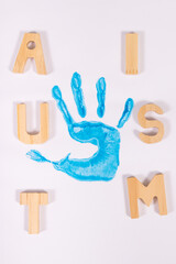 Kid handprint made of paint on white background. Autism spectrum disorder. Autism awareness