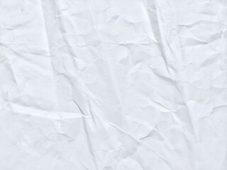 White paper texture with crumpled creases and soft shadows. Old white kraft paper background showing natural folds.