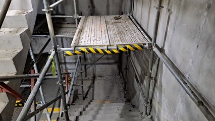scaffolding and working platform installed in a stairwell of a construction site