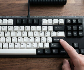 Finger pressing Enter key on custom mechanical keyboard top view