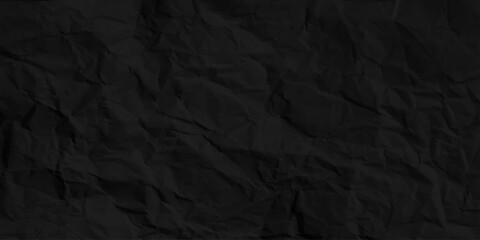 Black creased paper background texture