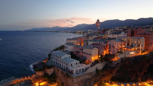 picturesque harbor during twilight hours, historic fortress overlooks tranquil water at evening. Bastia. France
