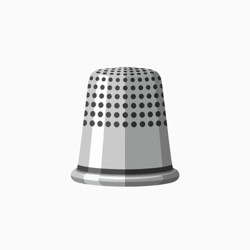 Close up view of a metallic thimble used for sewing protecting fingers when pushing a needle through fabric