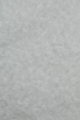 Top vertical view of white fabric background, cashmere texture