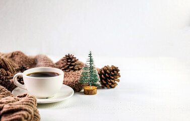 Cozy winter Coffee with pine cones and Chistmas tree decorationv