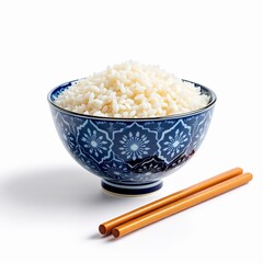 Steamed white rice served in a traditional blue and white patterned ceramic bowl with wooden chopsticks on white background