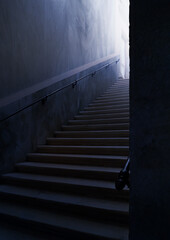 Sinister ancient long stairway with light effect at the end