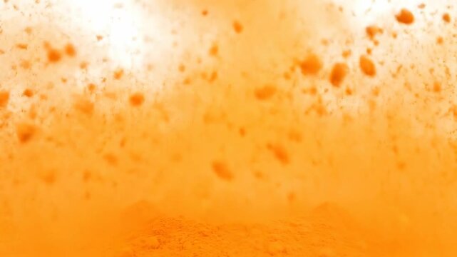 A macro abstract texture of cold beer bubbles forms a liquid gold and orange pattern inside the glass with shimmering foam drops