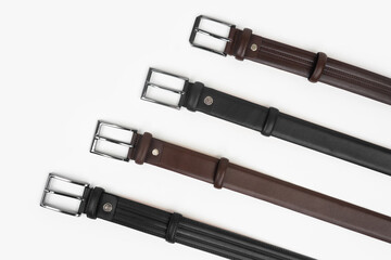 Leather Belts in Row on White Background
