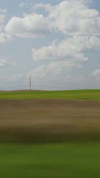 sunny summer day farmers field forest background landscape passenger side window pov vertical panorama 4k