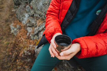Hiker enjoying tranquil moment on mountain edge, Person taking calm and restful break on mountain...