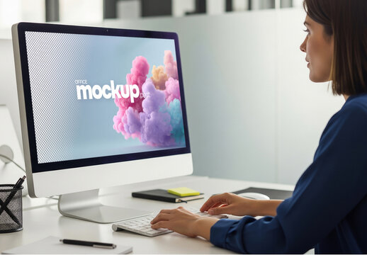 Mockup of woman working behind desktop screen in office setting