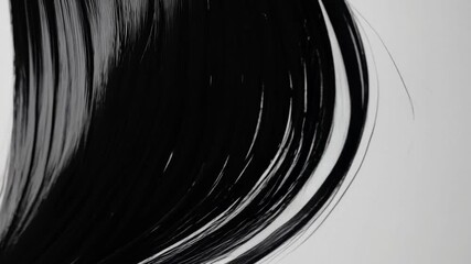 Close up view of black hair textures demonstrating styling techniques and artistic expression in studio setting