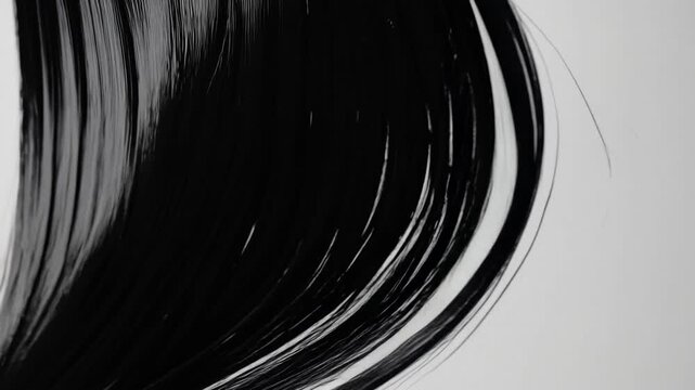 Close up view of black hair textures demonstrating styling techniques and artistic expression in studio setting