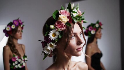 Flower crown fashion showcase featuring models with elaborate floral headpieces in a studio setting