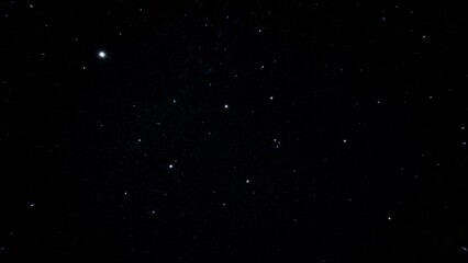 Night sky filled with stars, showcasing a dark celestial background with scattered points of light.