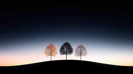 Three bare trees stand in silhouette on a rolling hill against a dark blue and soft orange gradient sky at dusk. One tree has a warm, golden hue, while the othe