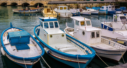Fishing boats in marina of Syracuse historic city, Sicily Island, Italy