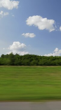 sunny day green landscape road trip passenger side window pov vertical panorama 4k