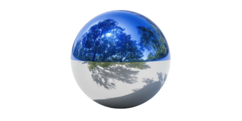 A spherical reflection of trees and sky against a contrasting white/grey surface, black background