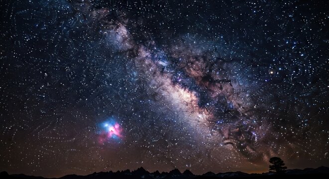 Milky Way galaxy and nebula above dark mountain silhouette and tree.