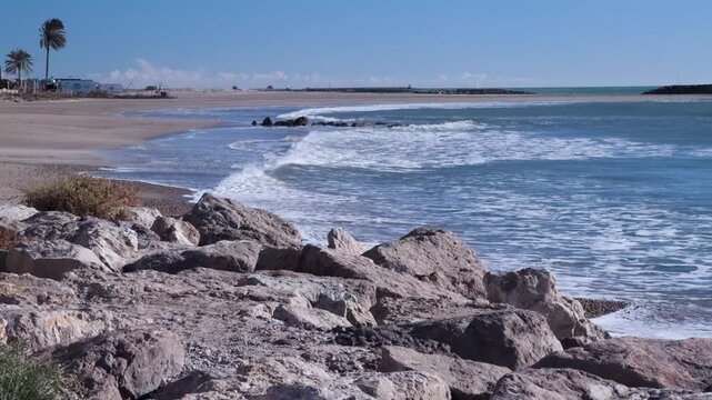 Windy day with waves on the beach of Cunit, Tarragona, Spain