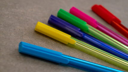 close-up of many colored pens