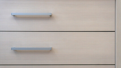 close-up of the texture and part of the cabinet with handles