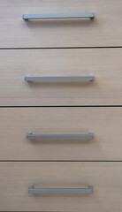 close-up of the texture and part of the cabinet with handles