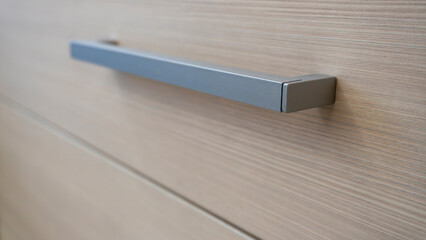 close-up of the texture and part of the cabinet with handles