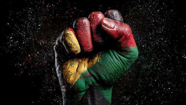 A clenched fist painted with the vibrant colors of the mali flag