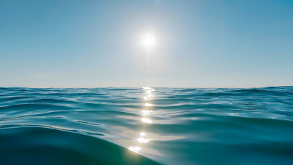 Obraz premium Sunlight reflecting on the ocean waves creating a beautiful and peaceful scene on a bright sunny day