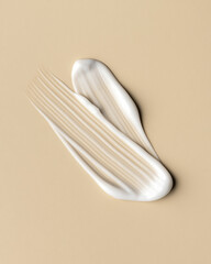 White Cream Smear on Beige Background