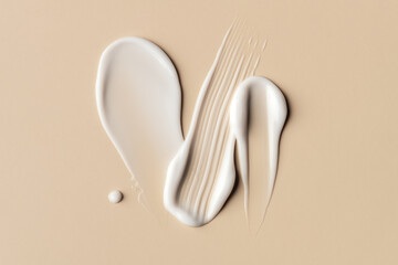 White Cream Smear on Beige Background