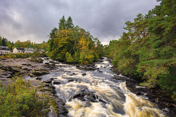 Killin Village and The Falls of Dochart, which are a series of rapids on the River Dochart in the village of Killin, Scotland, in the Trossachs National Park