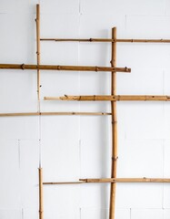 Bamboo lattice against white wall