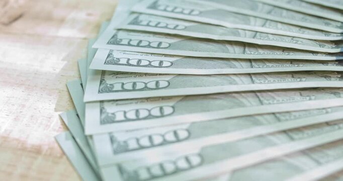 Slight rotation of a stack of 100 Dollar bills