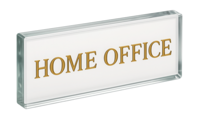 A glass nameplate with gold lettering for designating a personal home office.