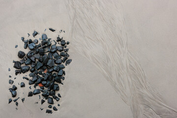 Texture of the sand surface on the beach after low tide. © Vitalii