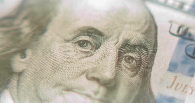 Macro view of Benjamin Franklin portrait on the 100 dollar bill