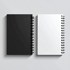 Two spiral-bound notebooks, black and white