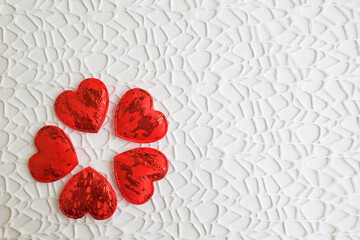 Red hearts on a white openwork background, love, heart, valentine's day, february 14, copyspace