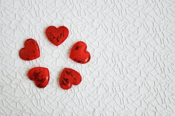 Red hearts on a white openwork background, love, heart, valentine's day, february 14, copyspace
