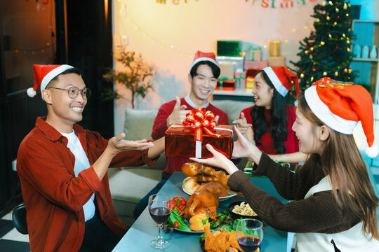 drinks and conversation, social gathering and get together. group and gift exchange at the event, celebration at home.