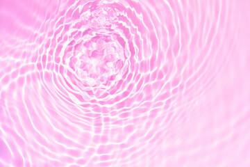 Pink water bubbles on the surface ripples. Defocus blurred transparent pink colored clear calm...