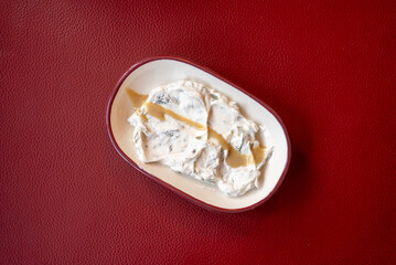Yogurt Meze with Olive Oil on Red Background