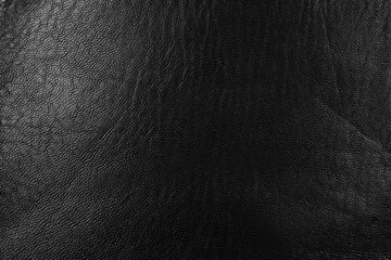 Black textured leather surface backdrop