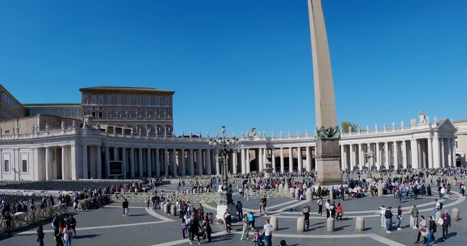 Crowd of people gathering in Piazza San Pietro of Vatican City to listen to pope speech during the eastern religious holidays, aerial slow motion shot