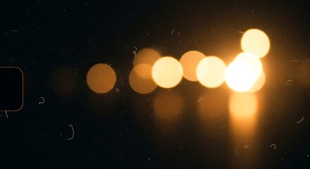 Abstract Warm Bokeh Lights on Dark Background for Visual Design
