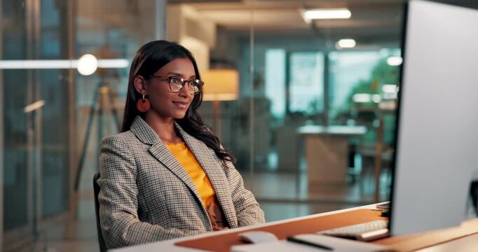 Woman, typing and happy at startup with computer, evening and complete project at media company. Person, writer and glasses with pc, overtime or reflection for finished proposal at creative agency